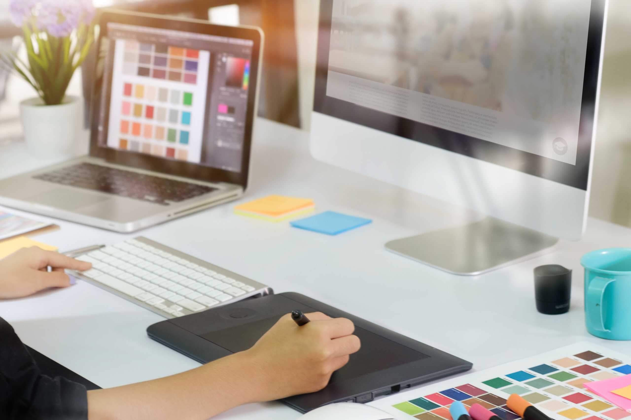 Young asian graphic designer working on computer.